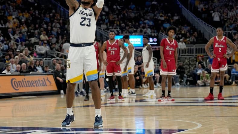 Nov 6, 2023; Milwaukee, Wisconsin, USA; Marquette forward David Joplin (23) shoots a free throw after a flagrant foul during the first half of their game against Northern Illinois  at Fiserv Forum. Mandatory Credit: Mark Hoffman-USA TODAY Sports