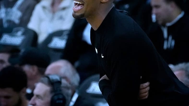 Friars coach Kim English guiding his team from the sidelines.