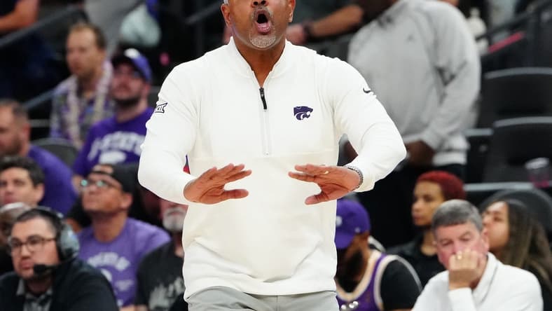 Nov 6, 2023; Las Vegas, Nevada, USA; Kansas State Wildcats head coach Jerome Tang talks to a player before the USC Trojans inbound the ball during the second half at T-Mobile Arena. Mandatory Credit: Stephen R. Sylvanie-USA TODAY Sports