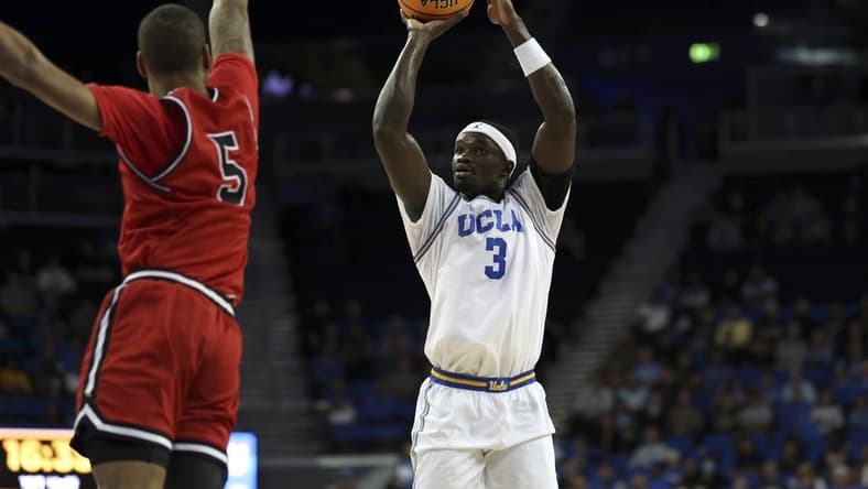 Nov 6, 2023; Los Angeles, California, USA;  UCLA Bruins forward Adem Bona (3) shoots against St. Francis (Pa) Red Flash forward Eli Wilborn (5) during the first half at Pauley Pavilion presented by Wescom. Mandatory Credit: Kiyoshi Mio-USA TODAY Sports