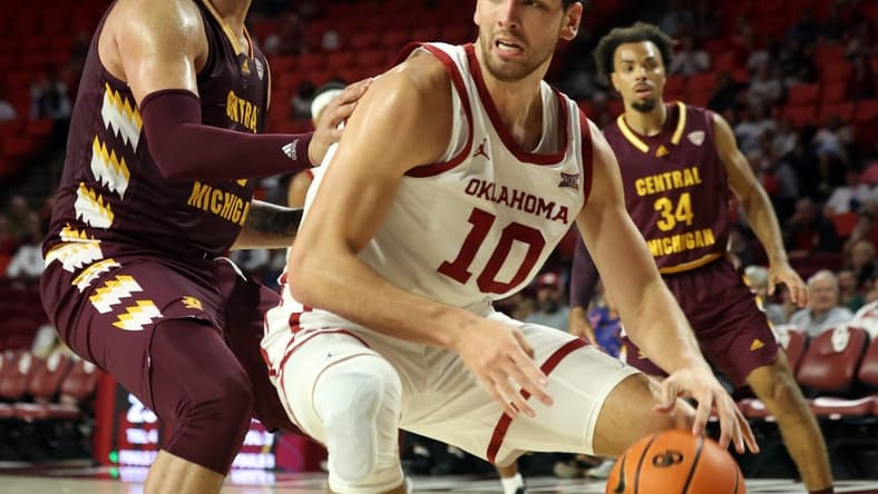 Oklahoma's Sam Godwin (10) drives past a Central Michigan defender during the college basketball game between the University of Oklahoma Sooners and Central Michigan Chippewas on Nov 6, 2023; Norman, Oklahoma, USA; at Lloyd Noble Center. Steve Sisney-The Oklahoman