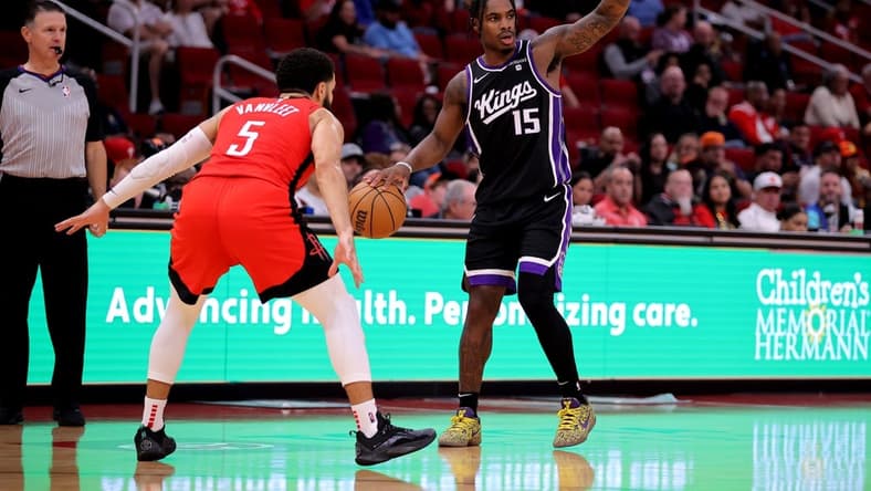 Nov 6, 2023; Houston, Texas, USA; Sacramento Kings guard Davion Mitchell (15) handles the ball against Houston Rockets guard Fred VanVleet (5) during the third quarter at Toyota Center. Mandatory Credit: Erik Williams-USA TODAY Sports