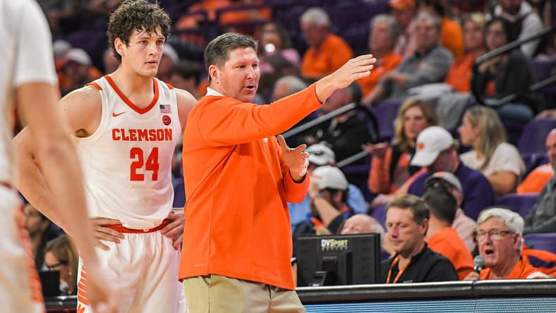 Clemson junior forward PJ Hall (24) listens to Clemson Head Coach Brad Brownell in the game with Winthrop during the second half at Littlejohn Coliseum in Clemson, S.C. Monday, November 6, 2023.