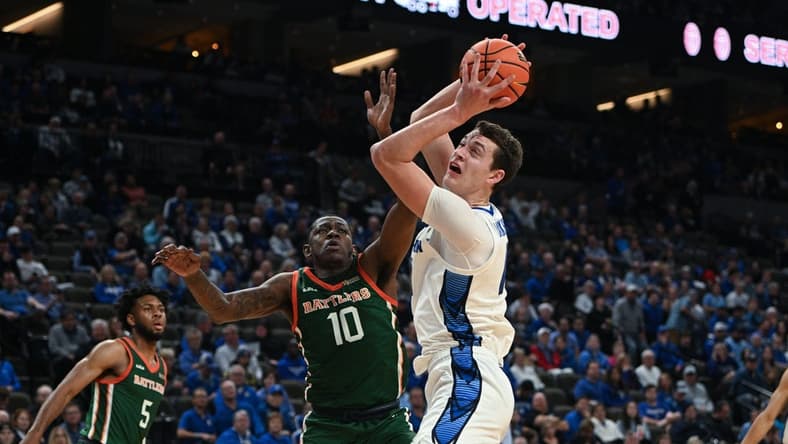 Nov 7, 2023; Omaha, Nebraska, USA; Creighton Bluejays center Ryan Kalkbrenner (11) drives against Florida A&M Rattlers forward Chase Barrs (10) in the second half at CHI Health Center Omaha. Mandatory Credit: Steven Branscombe-USA TODAY Sports