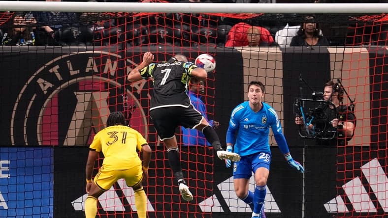 Nov 7, 2023; Atlanta, Georgia, USA; Atlanta United forward Giorgos Giakoumakis (7) scores a goal against Columbus Crew goalkeeper Diego Rossi (28) in the first half at Mercedes-Benz Stadium. Mandatory Credit: Brett Davis -USA TODAY Sports
