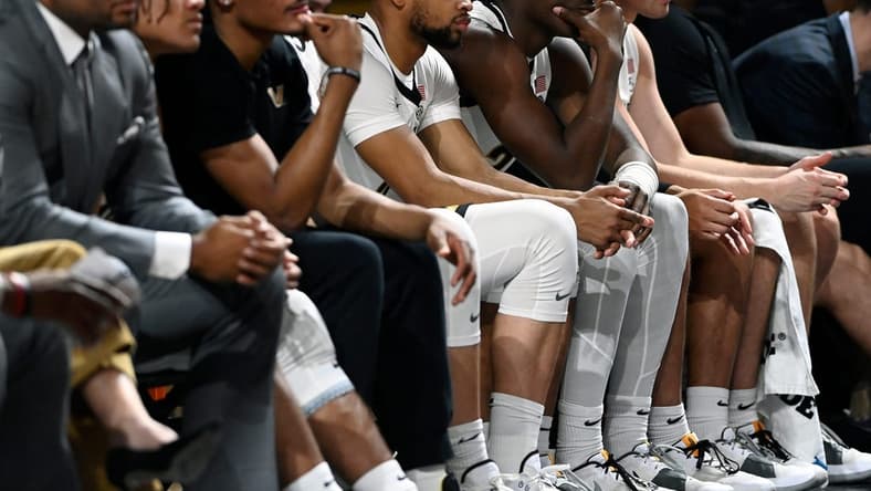 Vanderbilt players sit on the bench with a minute left to play during the second half of an NCAA college basketball game against Presbyterian Tuesday, Nov. 7, 2023, in Nashville, Tenn. Vanderbilt lost 68-62.