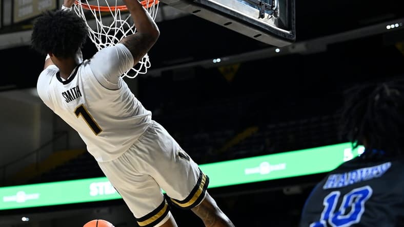 Vanderbilt forward Colin Smith (1) dunks the ball against Presbyterian during the first half of an NCAA college basketball game Tuesday, Nov. 7, 2023, in Nashville, Tenn.