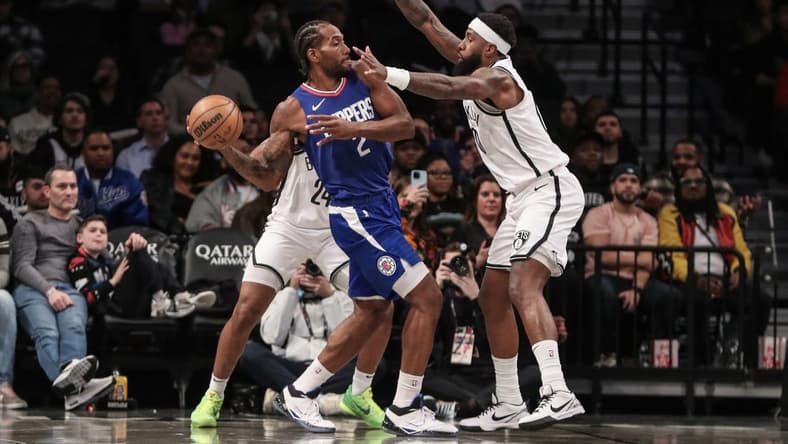 Nov 8, 2023; Brooklyn, New York, USA;  LA Clippers forward Kawhi Leonard (2) looks to make a pass while guarded by Brooklyn Nets forward Royce O'Neale (00) in the first quarter at Barclays Center. Mandatory Credit: Wendell Cruz-USA TODAY Sports