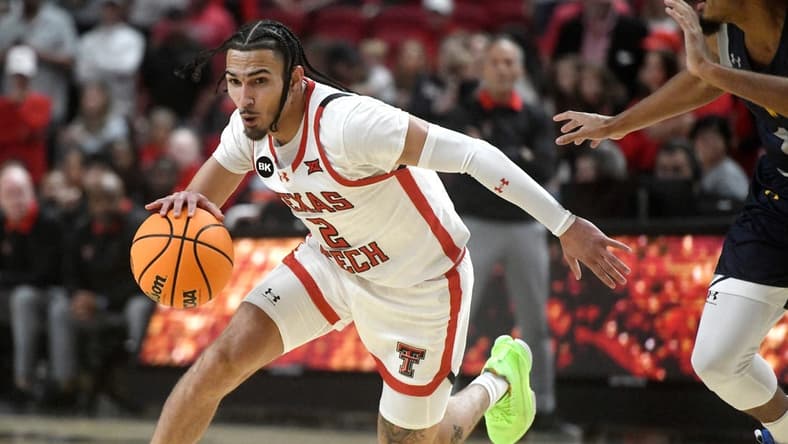 Texas Tech's guard Pop Isaacs (2) dribbles the ball against Texas A&M-Commerce in the first home game of the season, Wednesday, Nov. 8, 2023, at United Supermarkets Arena.