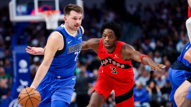 Nov 8, 2023; Dallas, Texas, USA; Dallas Mavericks guard Luka Doncic (77) dribbles past Toronto Raptors forward O.G. Anunoby (3) during the first quarter at American Airlines Center. Mandatory Credit: Kevin Jairaj-USA TODAY Sports