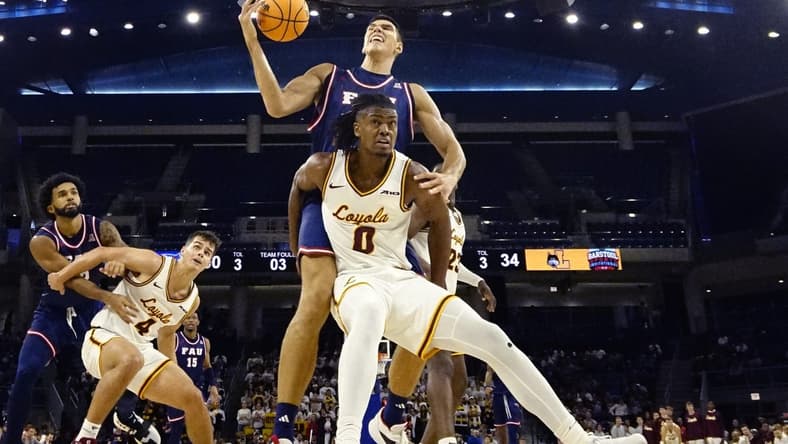 Nov 8, 2023; Chicago, Illinois, USA; Florida Atlantic Owls center Vladislav Goldin (50) is defended by Loyola Ramblers guard Desmond Watson (0)during the second half at Wintrust Arena. Mandatory Credit: David Banks-USA TODAY Sports