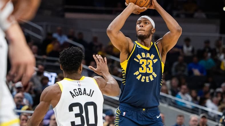 Nov 8, 2023; Indianapolis, Indiana, USA; Indiana Pacers center Myles Turner (33) shoots the ball while Utah Jazz guard Ochai Agbaji (30) defends in the second half at Gainbridge Fieldhouse. Mandatory Credit: Trevor Ruszkowski-USA TODAY Sports