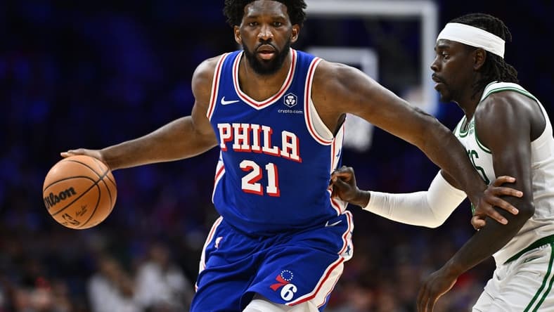 Nov 8, 2023; Philadelphia, Pennsylvania, USA; Philadelphia 76ers center Joel Embiid (21) drives against Boston Celtics guard Jrue Holiday (4) in the fourth quarter at Wells Fargo Center. Mandatory Credit: Kyle Ross-USA TODAY Sports