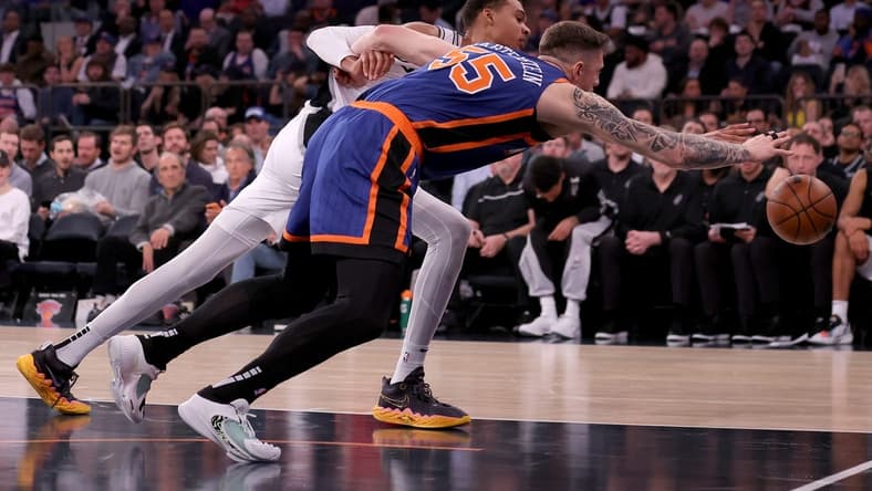 Nov 8, 2023; New York, New York, USA; San Antonio Spurs center Victor Wembanyama (1) and New York Knicks center Isaiah Hartenstein (55) fight for a loose ball during the second quarter at Madison Square Garden. Mandatory Credit: Brad Penner-USA TODAY Sports