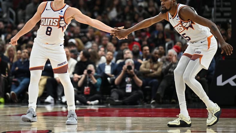 Nov 8, 2023; Chicago, Illinois, USA; Phoenix Suns forward Kevin Durant (35), right, congratulates guard Grayson Allen (8) after Allen hit a three-point shot in the second half against the Chicago Bulls at United Center. Mandatory Credit: Jamie Sabau-USA TODAY Sports