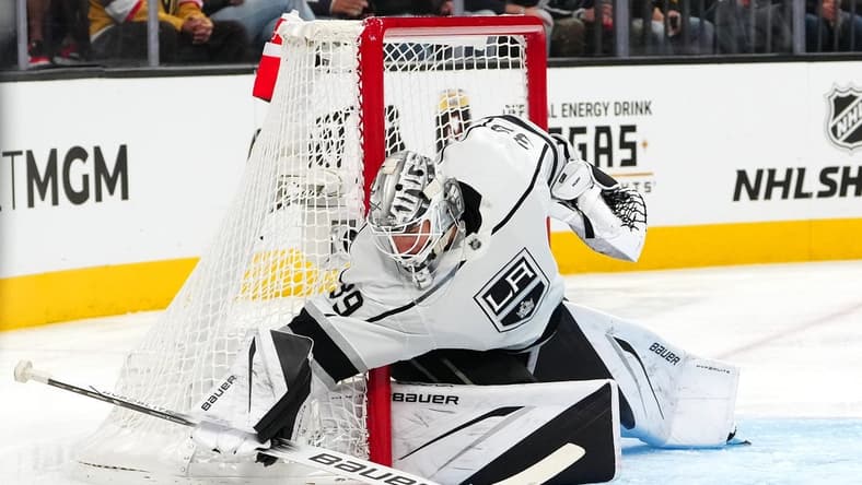 Nov 8, 2023; Las Vegas, Nevada, USA; Los Angeles Kings goaltender Cam Talbot (39) covers up a Vegas Golden Knights dump in during the second period at T-Mobile Arena. Mandatory Credit: Stephen R. Sylvanie-USA TODAY Sports