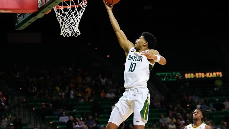 Nov 9, 2023; Waco, Texas, USA;  Baylor Bears guard RayJ Dennis (10) scores a layup against the John Brown Golden Eagles during the second half at Ferrell Center. Mandatory Credit: Chris Jones-USA TODAY Sports