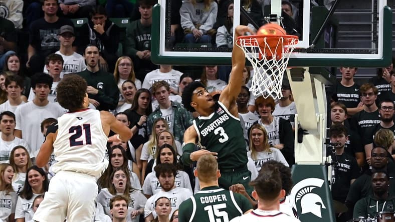 Nov 9, 2023; East Lansing, Michigan, USA; Michigan State Spartans guard Jaden Akins (3) dunks on a drive in the first half against the Southern Indiana Screaming Eagles at Jack Breslin Student Events Center. Mandatory Credit: Dale Young-USA TODAY Sports