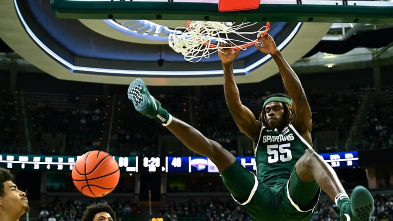 Nov 9, 2023; East Lansing, Michigan, USA; Michigan State Spartans forward Coen Carr (55) slams the ball through the basket during the second half against the Southern Indiana Screaming Eagles at Jack Breslin Student Events Center. Mandatory Credit: Dale Young-USA TODAY Sports