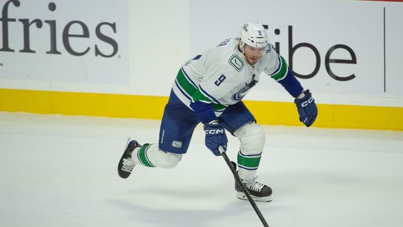 Nov 9, 2023; Ottawa, Ontario, CAN; Vancouver Canucks center J.T. Miller (9) skates with the puck in the third period against the Ottawa Senators at the Canadian Tire Centre. Mandatory Credit: Marc DesRosiers-USA TODAY Sports
