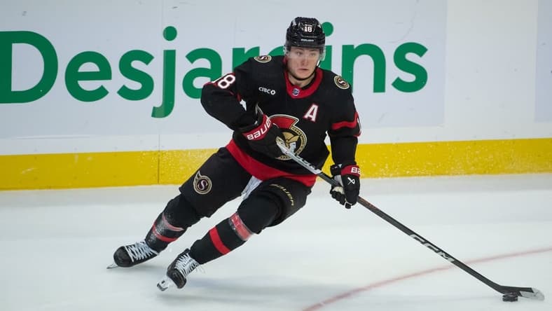 Nov 9, 2023; Ottawa, Ontario, CAN; Ottawa Senators center Tim Stutzle (18) skates with the puck in the third period against the Vancouver Canucks at the Canadian Tire Centre. Mandatory Credit: Marc DesRosiers-USA TODAY Sports