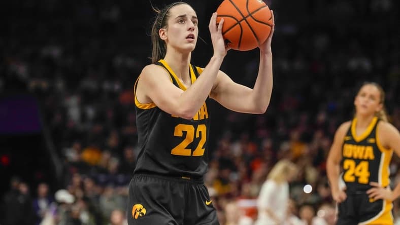 Nov 9, 2023; Charlotte, North Carolina, USA; Iowa Hawkeyes guard Caitlin Clark (22) sets up for a free throw during the second half against the Virginia Tech Hokies at Spectrum Center. Mandatory Credit: Jim Dedmon-USA TODAY Sports