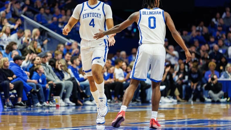 Nov 10, 2023; Lexington, Kentucky, USA; Kentucky Wildcats forward Tre Mitchell (4) fives guard Rob Dillingham (0) during the first half against the Texas A&M Commerce Lions at Rupp Arena at Central Bank Center. Mandatory Credit: Jordan Prather-USA TODAY Sports