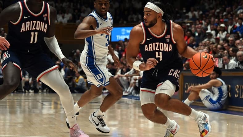 Nov 10, 2023; Durham, North Carolina, USA;  Arizona Wildcats guard Kylan Boswell (4) controls the ball during the first half against the Duke Blue Devils at Cameron Indoor Stadium. Mandatory Credit: Rob Kinnan-USA TODAY Sports