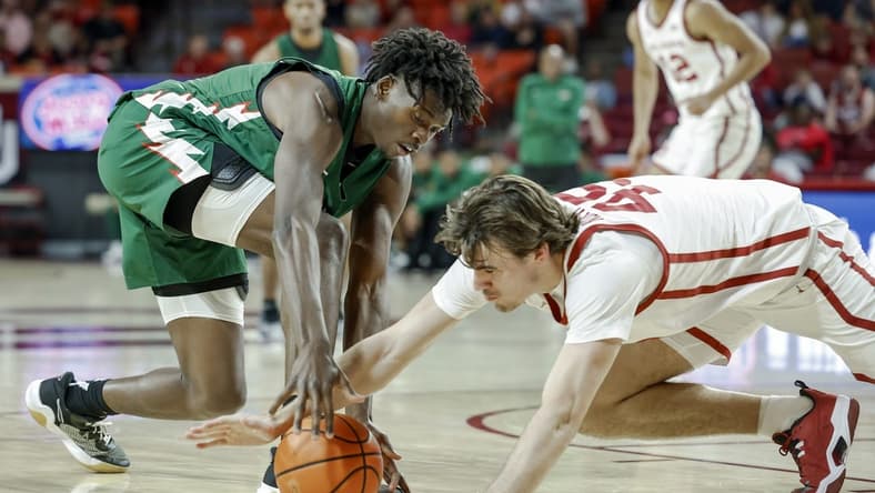 Nov 10, 2023; Norman, Oklahoma, USA;Mississippi Valley State Delta Devils forward Quoiren Waldon (20) and Oklahoma Sooners forward Luke Northweather (45) fight for a loose ball during the first half at Lloyd Noble Center. Mandatory Credit: Alonzo Adams-USA TODAY Sports