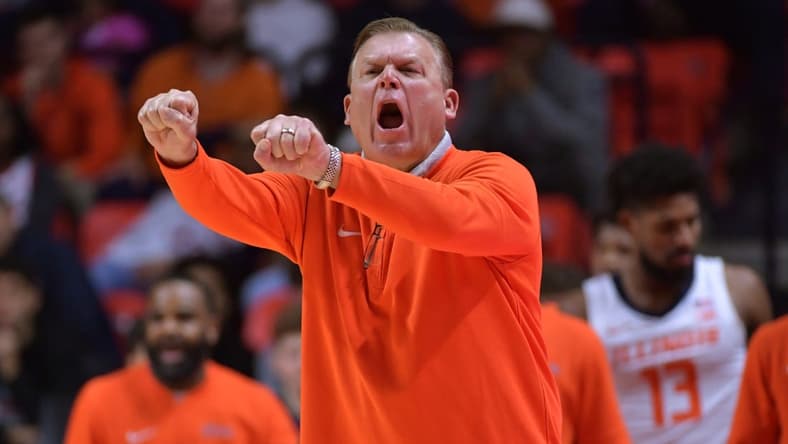Nov 10, 2023; Champaign, Illinois, USA;  Illinois Fighting Illini head coach Brad Underwood reacts off the bench during the first half against the Oakland Golden Grizzlies at State Farm Center. Mandatory Credit: Ron Johnson-USA TODAY Sports