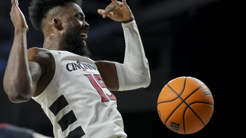 Nov 10, 2023; Cincinnati, Ohio, USA;  Cincinnati Bearcats forward John Newman III (15) reacts after dunking the ball against the Detroit Mercy Titans in the first half at Fifth Third Arena. Mandatory Credit: Aaron Doster-USA TODAY Sports