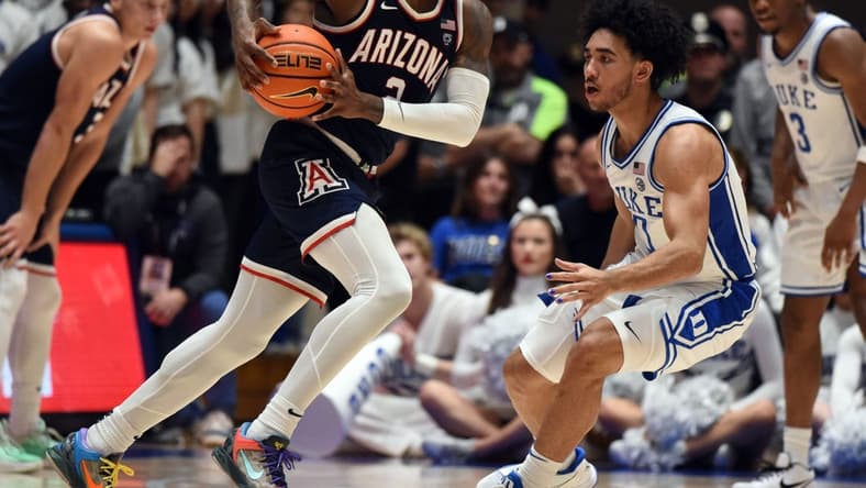Nov 10, 2023; Durham, North Carolina, USA;  Arizona Wildcats guard Caleb Love (2) drives to the basket as Duke Blue Devils guard Jared McCain (0) defends during the second half at Cameron Indoor Stadium. Mandatory Credit: Rob Kinnan-USA TODAY Sports