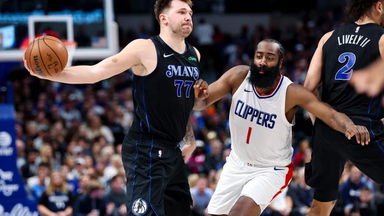 Nov 10, 2023; Dallas, Texas, USA;  Dallas Mavericks guard Luka Doncic (77) passes around LA Clippers guard James Harden (1) during the second quarter at American Airlines Center. Mandatory Credit: Kevin Jairaj-USA TODAY Sports