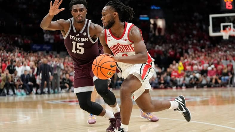 Nov 10, 2023; Columbus, Ohio, USA; Ohio State Buckeyes guard Bruce Thornton (2) drives past Texas A&M Aggies forward Henry Coleman III (15) during the second half of the NCAA basketball game at Value City Arena. Ohio State lost 73-66.