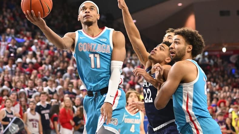 Nov 10, 2023; Spokane, Washington, USA; Gonzaga Bulldogs guard Nolan Hickman (11) shoots the ball against Yale Bulldogs forward Matt Knowling (22) in the first half at McCarthey Athletic Center. Mandatory Credit: James Snook-USA TODAY Sports