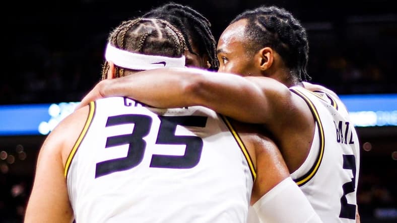 Missouri's Noah Carter (35) huddles with Tamar Bates (right) and other Missouri players during a college basketball game against Memphis at Mizzou Arena on Nov. 10, 2023, in Columbia, Mo.