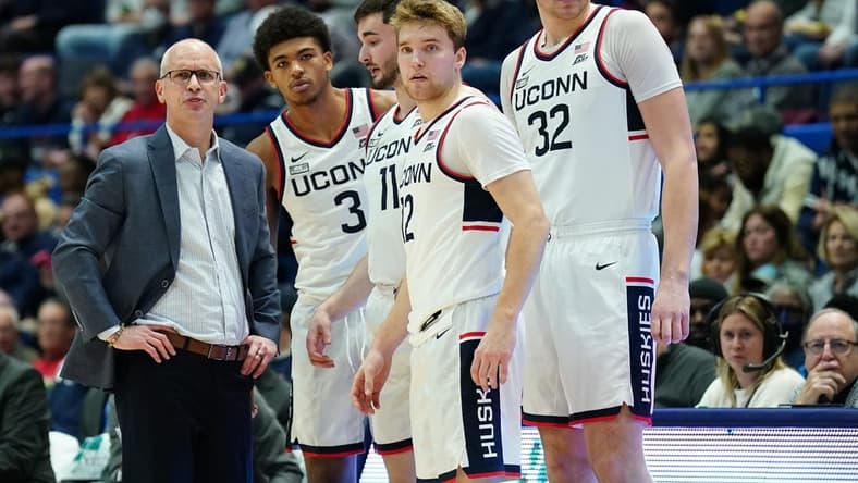 Nov 11, 2023; Hartford, Connecticut, USA; UConn Huskies head coach Dan Hurley talks with forward Jaylin Stewart (3), forward Alex Karaban (11), center Donovan Clingan (32) and guard Cam Spencer (12) from the sideline as they take on the Stonehill Skyhawks at XL Center. Mandatory Credit: David Butler II-USA TODAY Sports