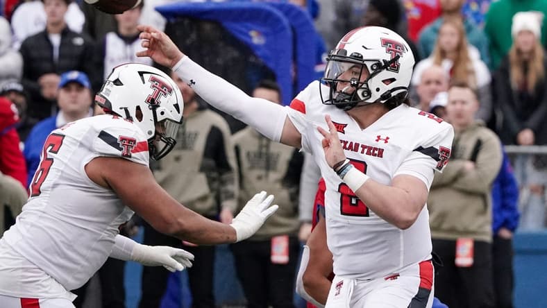 Nov 11, 2023; Lawrence, Kansas, USA; Texas Tech Red Raiders quarterback Behren Morton (2) throws a pass against the Kansas Jayhawks during the second half at David Booth Kansas Memorial Stadium. Mandatory Credit: Denny Medley-USA TODAY Sports