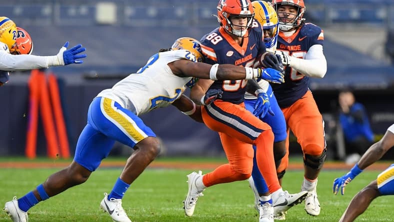 Nov 11, 2023; New York, New York, USA;  Pittsburgh Panthers defensive back Noah Biglow (28) attempts a tackle ion Syracuse Orange tight end Dan Villari (89) during the first half at Yankee Stadium. Mandatory Credit: Dennis Schneidler-USA TODAY Sports