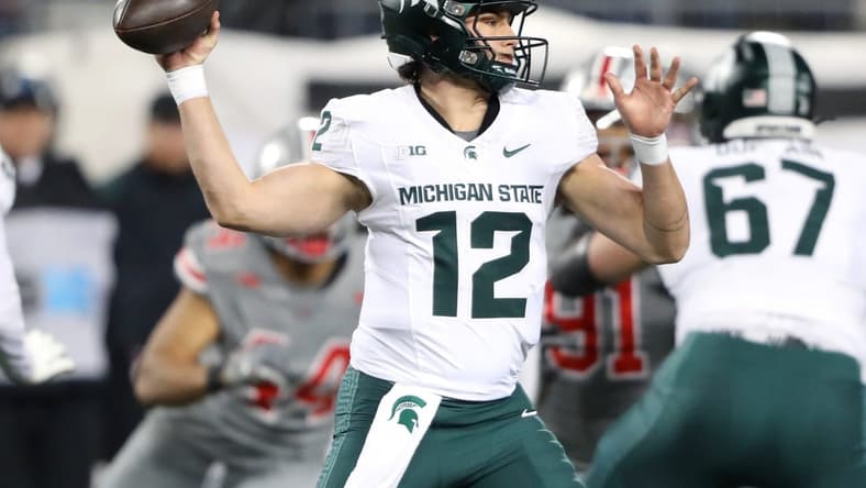 Nov 11, 2023; Columbus, Ohio, USA; Michigan State Spartans quarterback Katin Houser (12) drops back to throw during the first quarter against the Ohio State Buckeyes at Ohio Stadium. Mandatory Credit: Joseph Maiorana-USA TODAY Sports