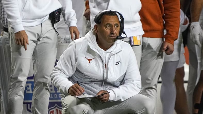 Nov 11, 2023; Fort Worth, Texas, USA; Texas Longhorns head coach Steve Sarkisian kneels on the sideline during the game against the TCU Horned Frogs at Amon G. Carter Stadium. Mandatory Credit: Aaron E. Martinez-USA TODAY Sports