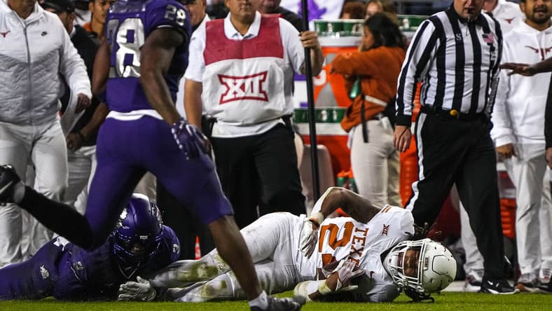 Nov 11, 2023; Fort Worth, Texas, USA; Texas Longhorns running back Jonathon Brooks (24) is brought down by TCU Horned Frogs cornerback Josh Newton (3) during the game at Amon G. Carter Stadium. Mandatory Credit: Aaron E. Martinez-USA TODAY Sports