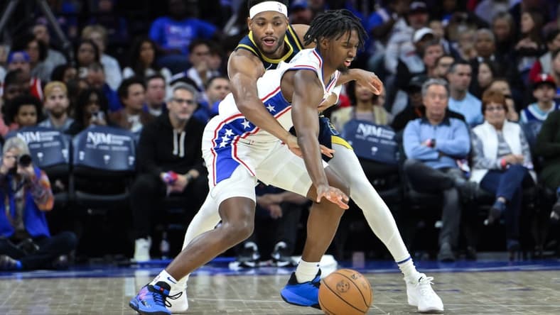 Nov 12, 2023; Philadelphia, Pennsylvania, USA; Indiana Pacers forward Bruce Brown (11) tries to steal the ball away from Philadelphia 76ers guard Tyrese Maxey (0) during the first quarter at Wells Fargo Center. Mandatory Credit: John Jones-USA TODAY Sports
