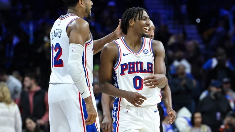 Nov 12, 2023; Philadelphia, Pennsylvania, USA; Philadelphia 76ers guard Tyrese Maxey (0) is greeted by Philadelphia 76ers forward Tobias Harris (12) after a 50 point performance against the Indiana Pacers at Wells Fargo Center. Mandatory Credit: John Jones-USA TODAY Sports