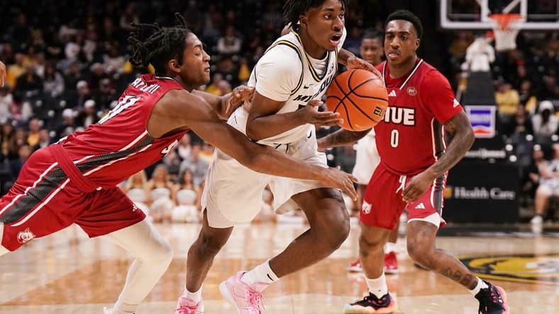 Nov 13, 2023; Columbia, Missouri, USA; Missouri Tigers guard Anthony Robinson II (14) dribbles the ball and is fouled by SIU Edwardsville Cougars guard Brian Taylor II (11) during the first half at Mizzou Arena. Mandatory Credit: Denny Medley-USA TODAY Sports