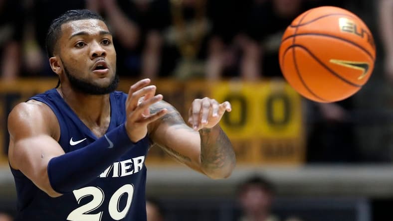 Xavier Musketeers guard Dayvion McKnight (20) passes the ball during the NCAA men   s basketball game against the Purdue Boilermakers, Monday, Nov. 13, 2023, at Mackey Arena in West Lafayette, Ind. Purdue Boilermakers won 83-71.