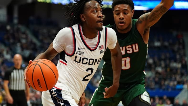 Nov 14, 2023; Hartford, Connecticut, USA; UConn Huskies guard Tristen Newton (2) drives the ball against Mississippi Valley State Delta Devils guard Rayquan Brown (0) in the first half at XL Center. Mandatory Credit: David Butler II-USA TODAY Sports