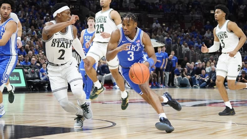 Nov 14, 2023; Chicago, Illinois, USA; Michigan State Spartans guard Tyson Walker (2) defends Duke Blue Devils guard Jeremy Roach (3) during the first half at United Center. Mandatory Credit: David Banks-USA TODAY Sports