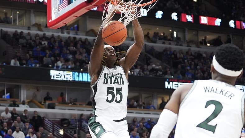 Nov 14, 2023; Chicago, Illinois, USA; Michigan State Spartans forward Coen Carr (55) dunks the ball against the Duke Blue Devils during the second half at United Center. Mandatory Credit: David Banks-USA TODAY Sports