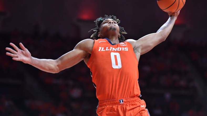 Nov 14, 2023; Champaign, Illinois, USA; Illinois Fighting Illini guard Terrence Shannon Jr. (0) dunks the ball during the first half against the Marquette Golden Eagles at State Farm Center. Mandatory Credit: Ron Johnson-USA TODAY Sports